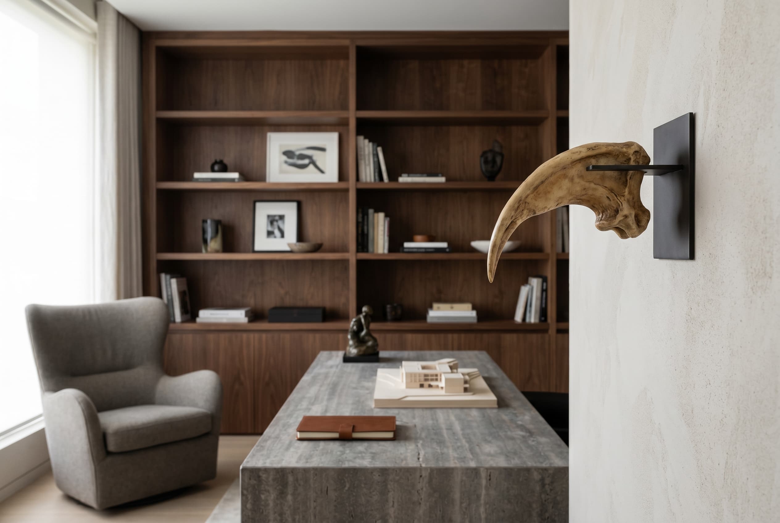 Velociraptor Claw — staged render in a staged setting